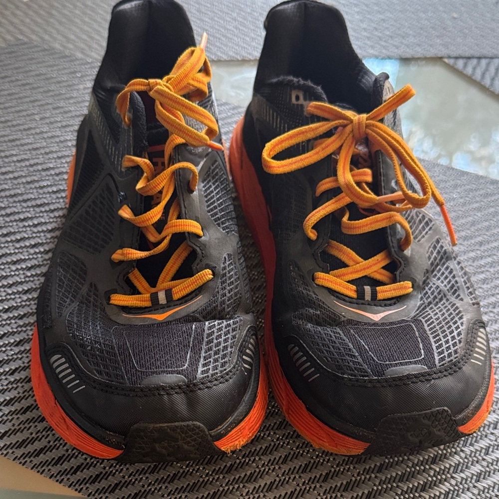Hoka Black and Orange Running Shoes